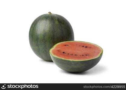 Whole and half watermelon on white background