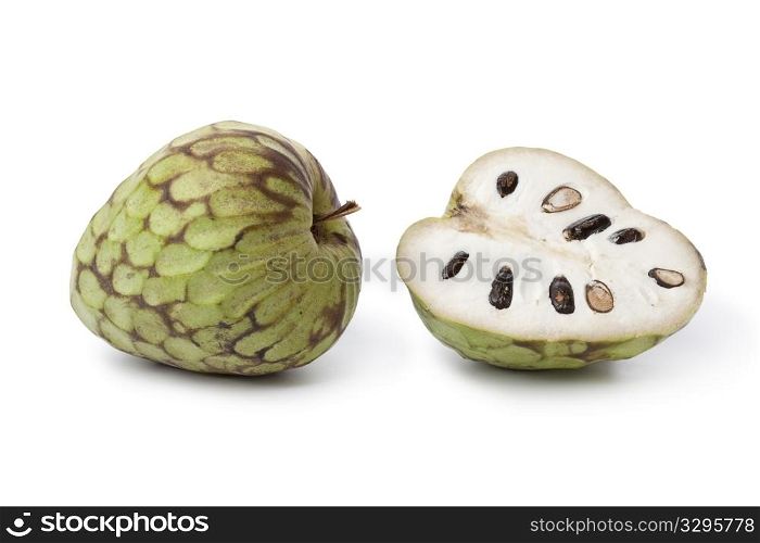 Whole and partial Cherimoya fruit isolated on white background