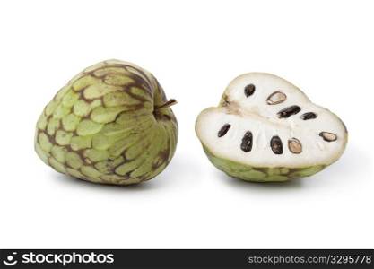 Whole and partial Cherimoya fruit isolated on white background