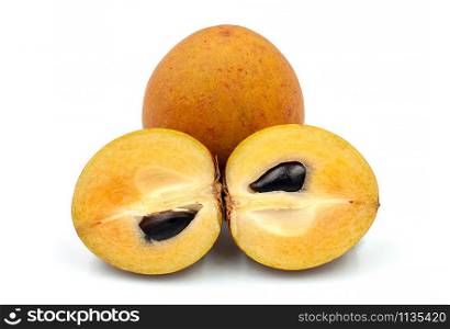 Whole and partial fresh sapodilla isolated on white background