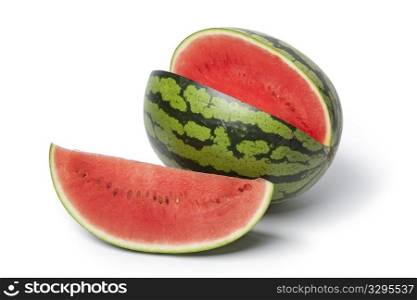 Whole and partial water melon on white background