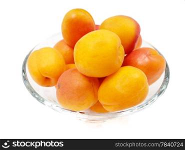 Whole apricot in a glass bowl isolated towards white