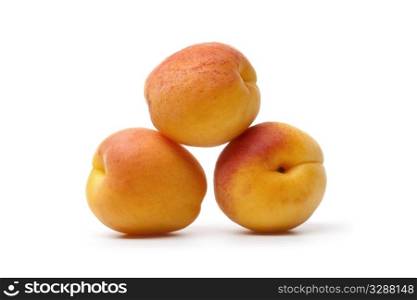 Whole apricots isolated on white background