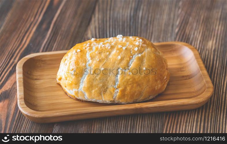 Whole beef Wellington on the wooden plate