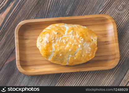 Whole beef Wellington on the wooden plate