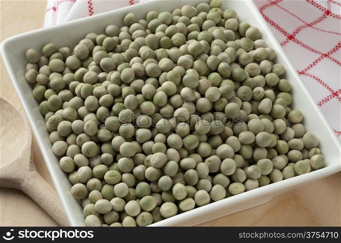 Whole dried green peas in a bowl