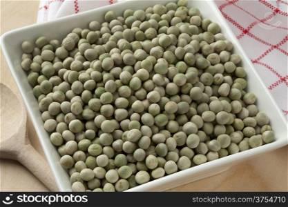 Whole dried green peas in a bowl