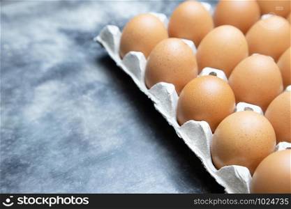 whole eggs in box. Chicken egg many floors on the table.
