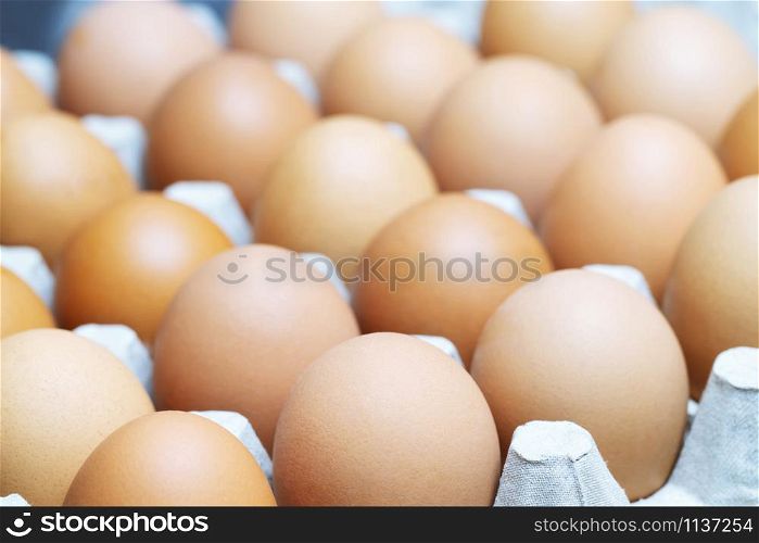 whole eggs in box. Chicken egg on the table.