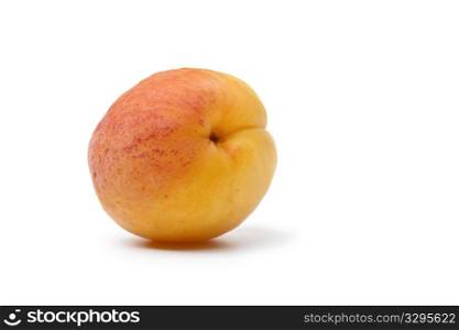 Whole fresh apricot isolated on white background