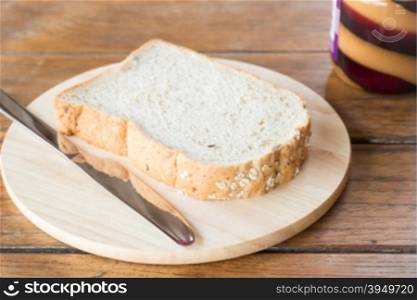 Whole grain bread on wooden plate, stock photo