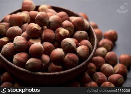 Whole hazelnuts nuts with shell close-up studio shot.. Whole hazelnuts nuts with shell close-up studio shot