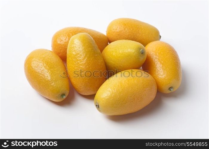 Whole Kumquats on white background