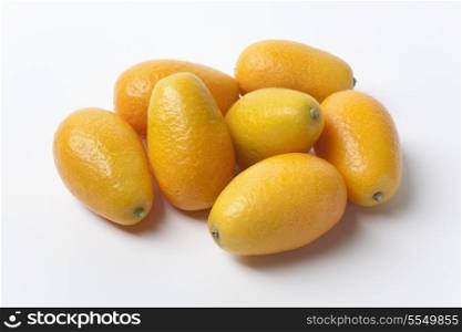 Whole Kumquats on white background