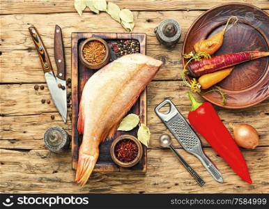 Whole raw fresh red perch or seabass.Raw fish on wooden background. Uncooked red perch