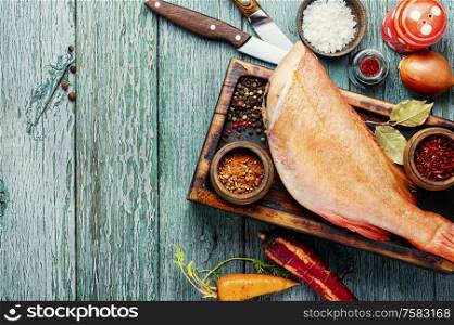 Whole raw fresh red perch or seabass.Raw fish seabass on wooden background. Fresh raw sea bass