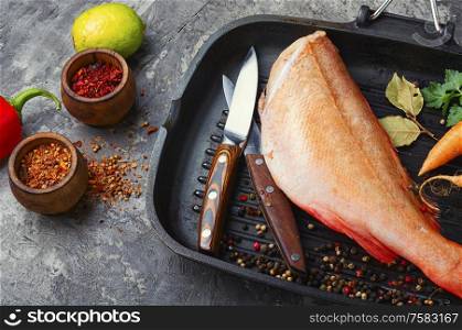 Whole raw fresh red perch or seabass.. Uncooked red perch