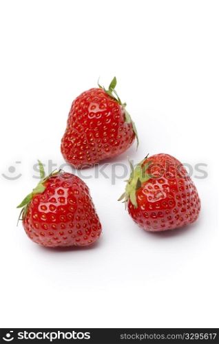 Whole red strawberrie on white background