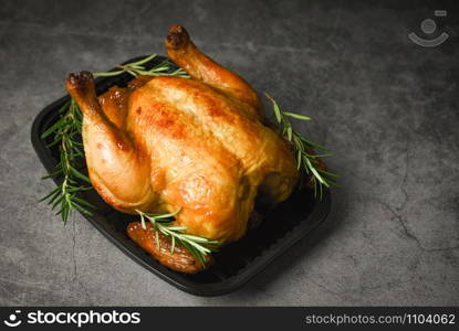 Whole roasted chicken rosemary / Baked chicken grilled barbecue delicious food on dining table at holiday celebrate