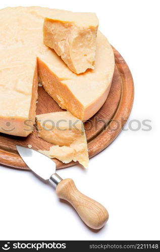 Whole round Head and pieces of parmesan or parmigiano hard cheese. Whole round Head and pieces of parmesan or parmigiano