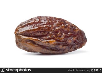 Whole single dried date on white background