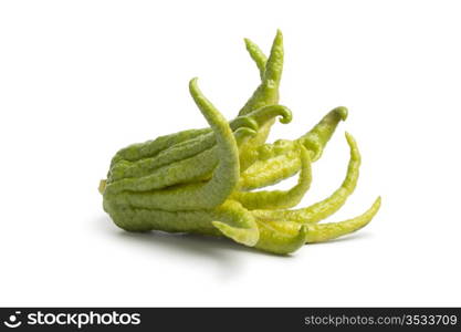 Whole single fingered citron fruit on white background