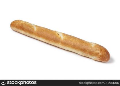 Whole single French bread, baguette on white background