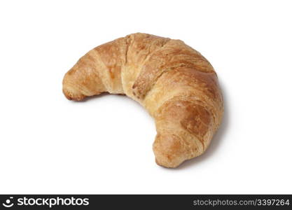 Whole single French croissant on white background