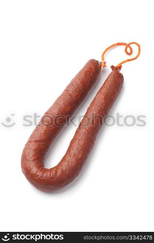 Whole single Spanish chorizo sausage on white background