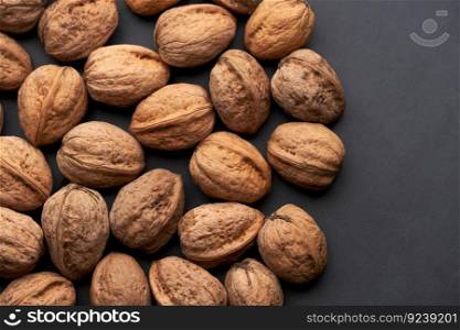Whole walnuts nuts with shells close-up background studio shot.. Whole walnuts nuts with shells close-up background studio shot