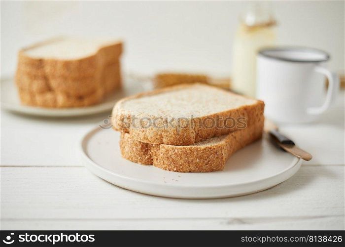 Whole wheat bread baked on wooden background. . Whole wheat bread baked.