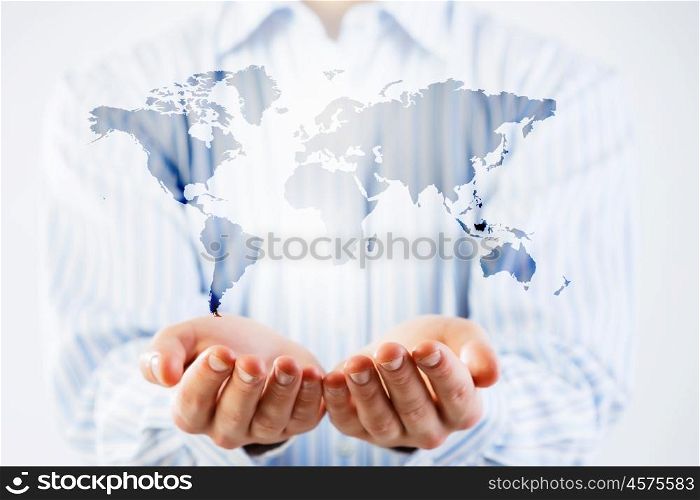 Whole world in hands. Businessman holding in palms digital Earth planet representing global technologies concept