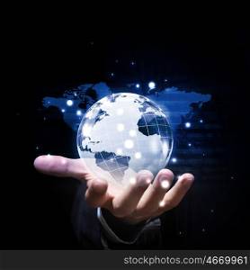 Whole world in hands. Close up of businessman hand showing digital planet