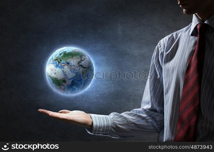 Whole world in hands. Close up of human hands holding Earth planet. Elements of this image are furnished by NASA