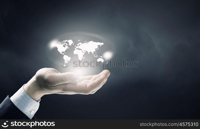 Whole world in hands. Close up of male hand holding map icon