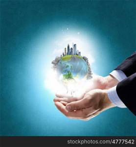 Whole world in hands. Hands holding Earth planet concept. Elements of this image are furnished by NASA