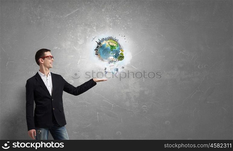 Whole world in his hand. Young businessman holding Earth planet in hand. Elements of this image are furnished by NASA