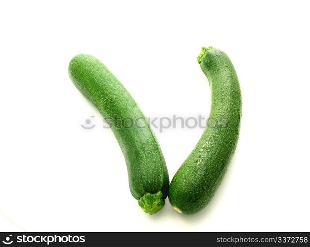 Whole zucchini vegetable isolated towards white background