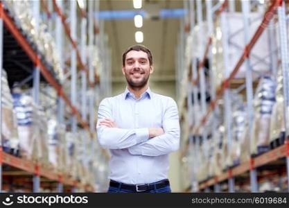 wholesale, logistic, business, export and people concept - happy man at warehouse