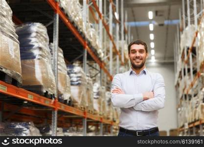 wholesale, logistic, business, export and people concept - happy man at warehouse