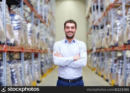 wholesale, logistic, business, export and people concept - happy man at warehouse