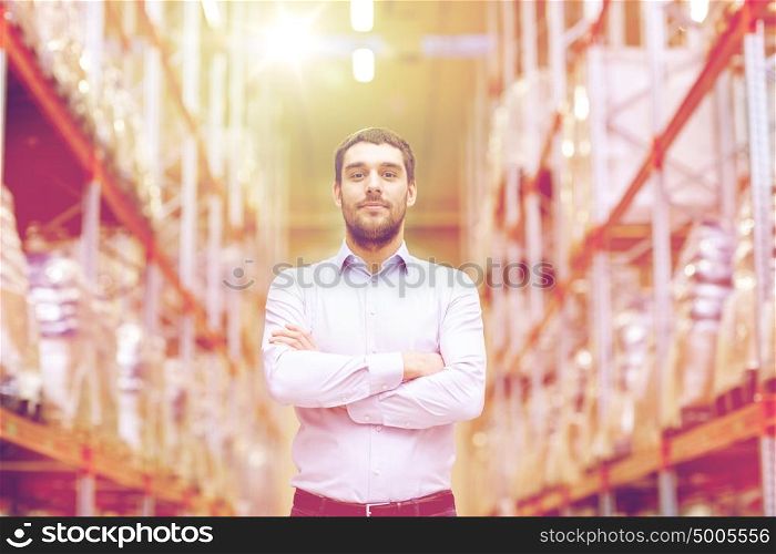 wholesale, logistic, business, export and people concept - happy man at warehouse. happy man at warehouse