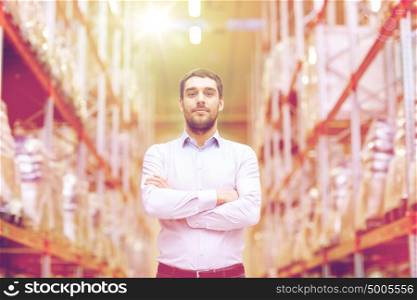 wholesale, logistic, business, export and people concept - happy man at warehouse. happy man at warehouse