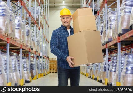 wholesale, logistic, business, export and people concept - happy man or loader in helmet with cardboard box over warehouse background
