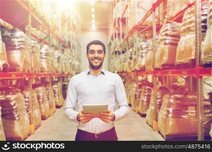 wholesale, logistic, business, export and people concept - happy man or manager with tablet pc computer at warehouse