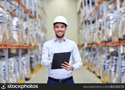 wholesale, logistic, business, export and people concept - happy man or manager with clipboard checking goods at warehouse