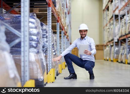 wholesale, logistic, business, export and people concept - happy man or manager with tablet pc computer checking goods at warehouse