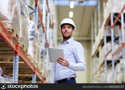 wholesale, logistic, business, export and people concept - happy man or manager with tablet pc computer checking goods at warehouse