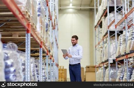 wholesale, logistic, business, export and people concept - happy man or manager with tablet pc computer checking goods at warehouse