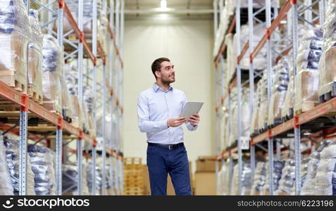 wholesale, logistic, business, export and people concept - happy man or manager with tablet pc computer checking goods at warehouse